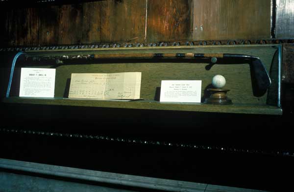 Calamity Jane II, the putter Bob Jones used in winning 10 of his national championships. Mounted inside the case with Calamity Jane II are the scorecard and ball from the final match of the 1930 U.S. Amateur.